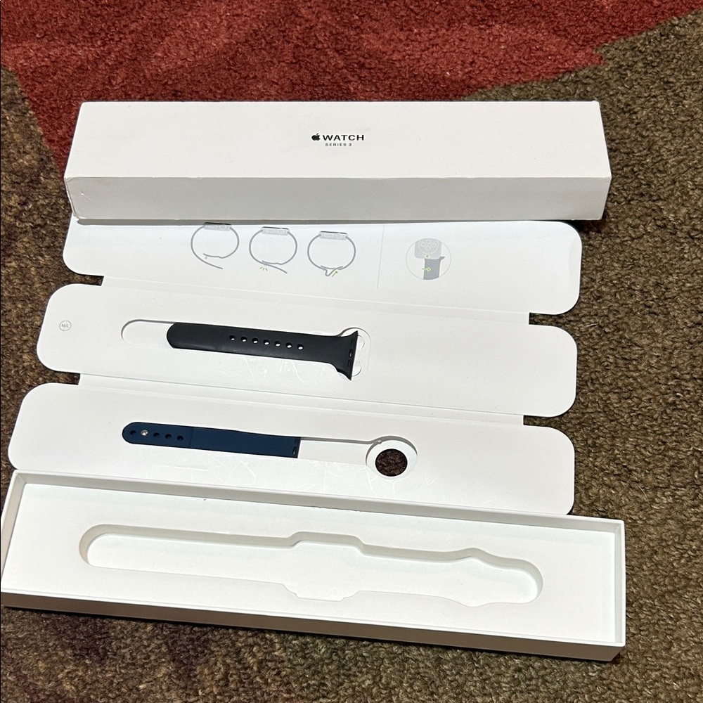 It's the empty box with only the bracelets shown in the photo no smartwatch